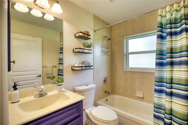 full bathroom with toilet, vanity, and shower / bath combination with curtain