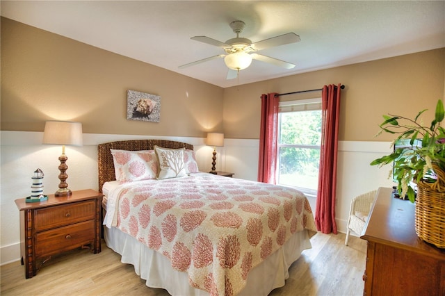 39 Tee View Pl, Rotonda West, FL 33947 - bedroom with light wood finished floors and a ceiling fan