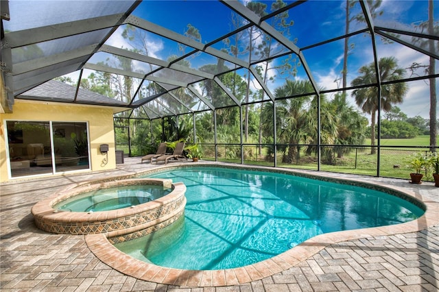 39 Tee View Pl, Rotonda West, FL 33947 - view of swimming pool with a patio area, a pool with connected hot tub, and glass enclosure