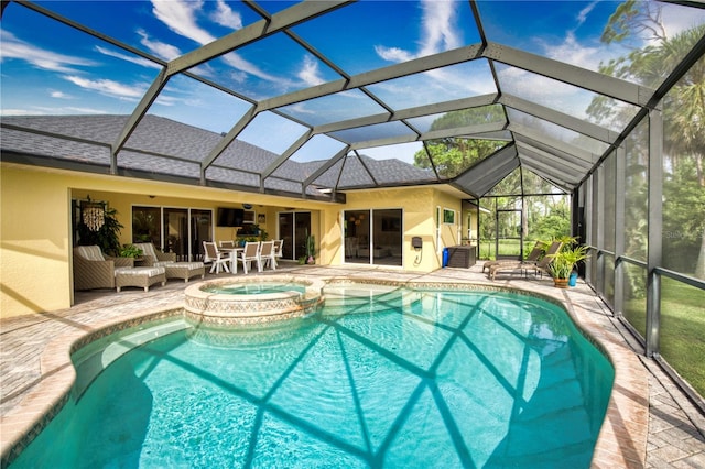 view of pool with an in ground hot tub, an outdoor living space, a patio area, glass enclosure, and ceiling fan