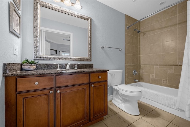 full bathroom with tile patterned flooring, vanity, shower / tub combo, and toilet