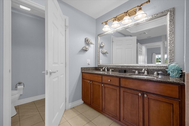 bathroom with tile patterned floors, vanity, and toilet