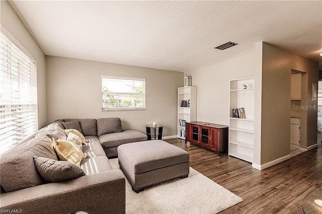 living room with dark wood-type flooring