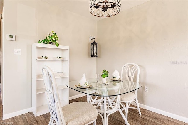 dining space featuring wood-type flooring