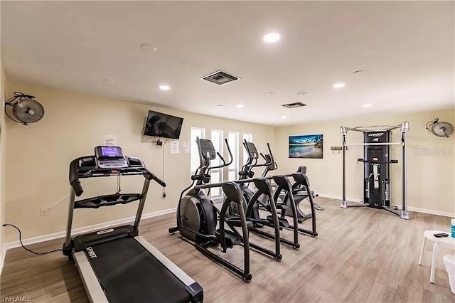 workout area with light wood-type flooring