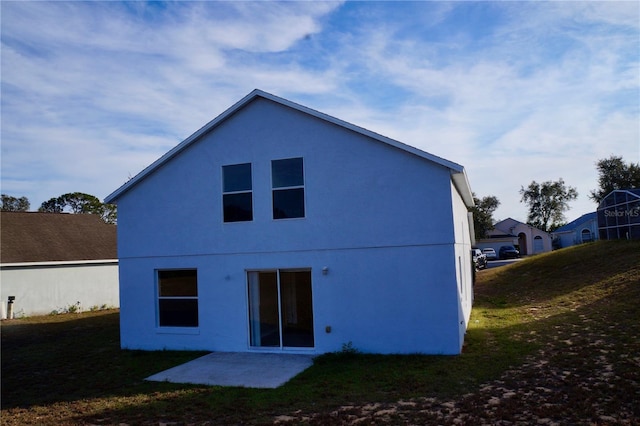 rear view of house featuring a patio