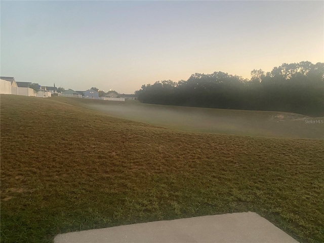 view of property's community with a lawn