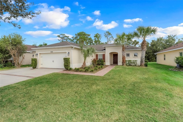 view of front of property featuring a garage and a front yard