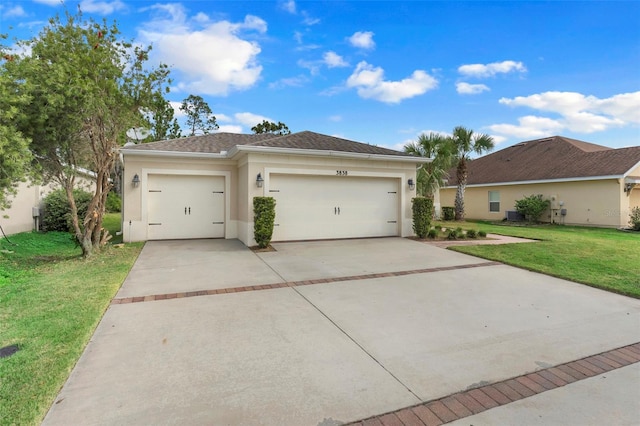 view of front facade with a front lawn and a garage