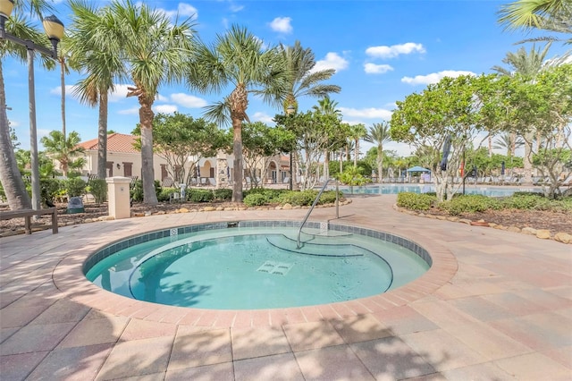 view of pool featuring a community hot tub