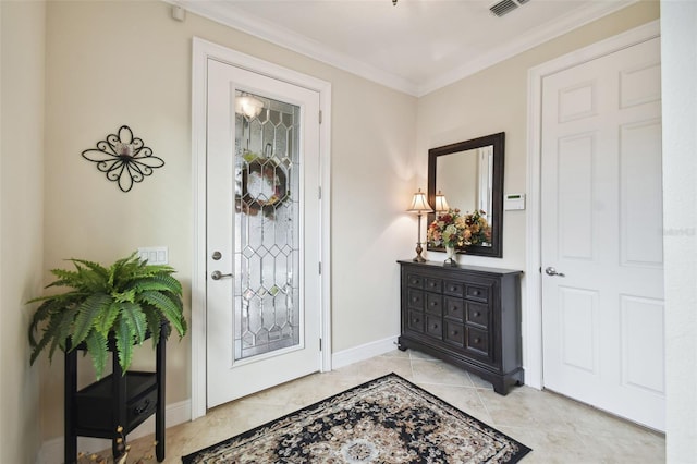 foyer with light tile patterned floors and crown molding