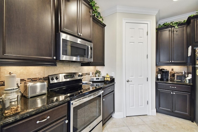 kitchen featuring dark stone countertops, appliances with stainless steel finishes, dark brown cabinetry, and crown molding