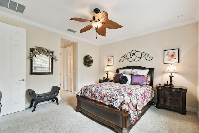 carpeted bedroom with ceiling fan and crown molding