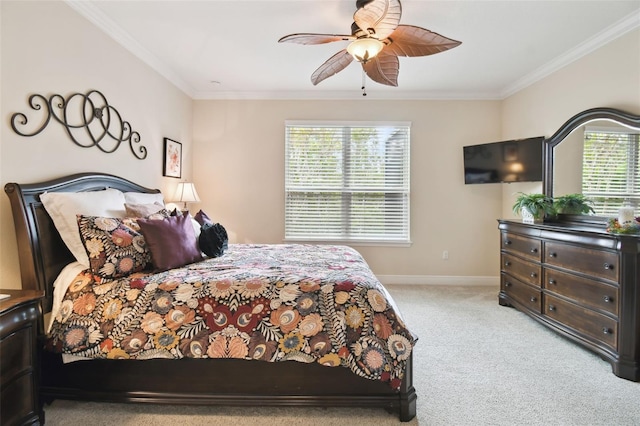 bedroom featuring light carpet, ceiling fan, and crown molding