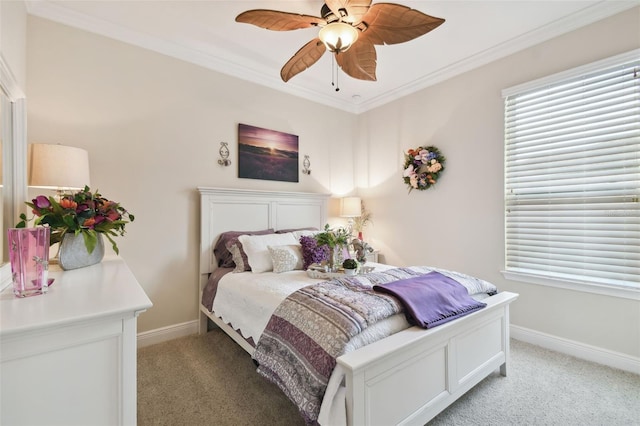 carpeted bedroom with ceiling fan and crown molding