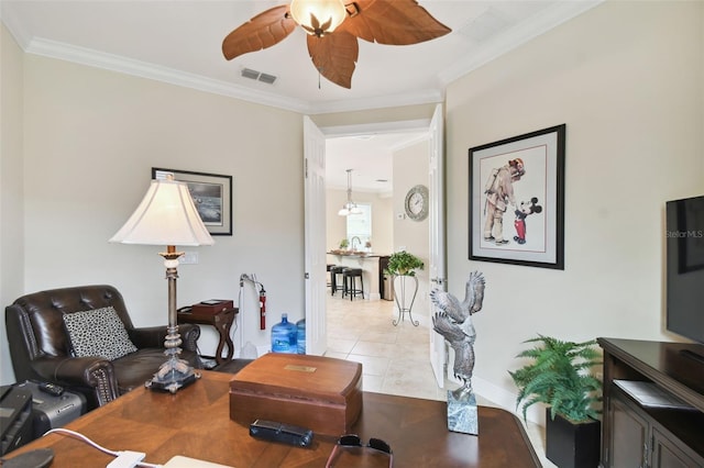 tiled living room featuring ornamental molding and ceiling fan