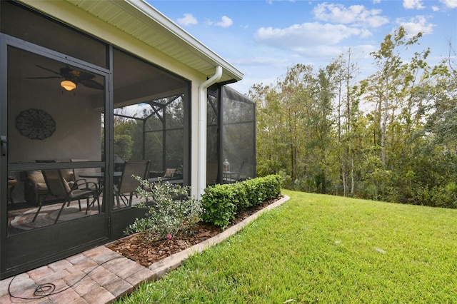 view of yard featuring a sunroom