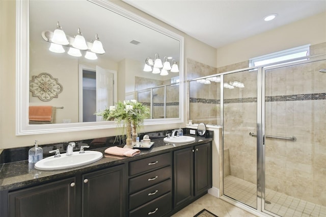 bathroom featuring vanity, walk in shower, and tile patterned floors