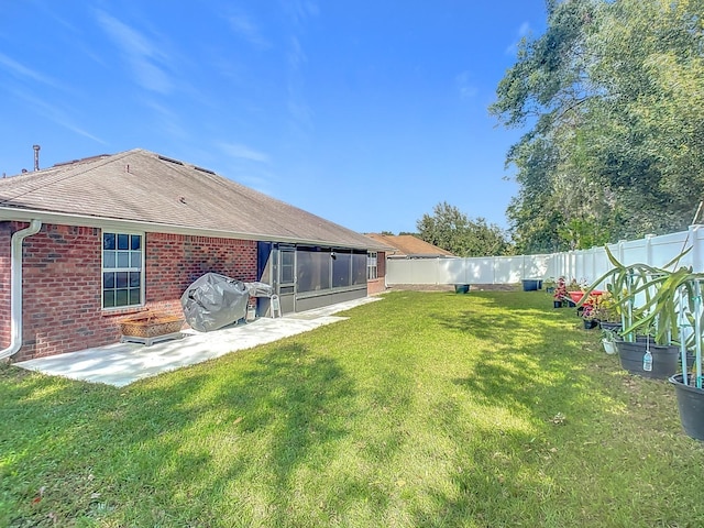 back of house featuring a yard and a patio area