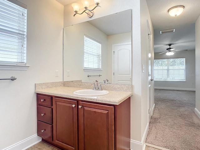 bathroom with vanity and ceiling fan