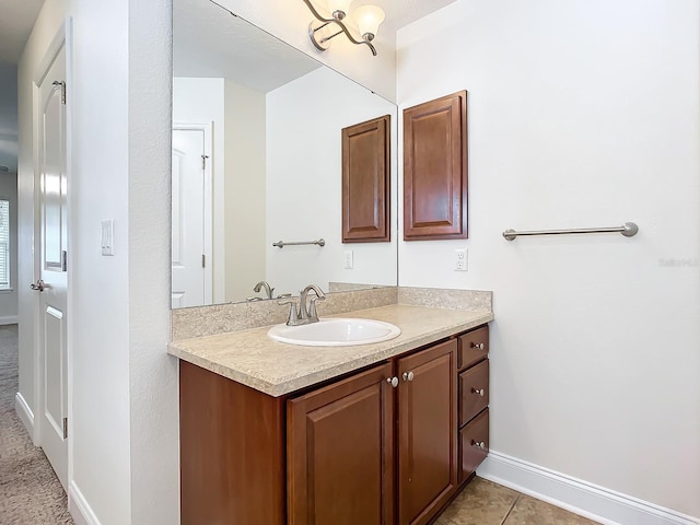 bathroom with tile patterned floors and vanity