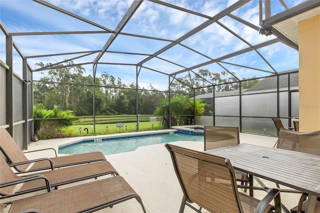 view of swimming pool featuring a lanai, an in ground hot tub, and a patio area