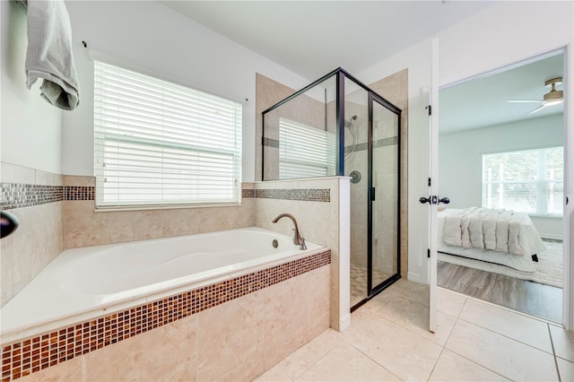 bathroom with ceiling fan, tile patterned flooring, and shower with separate bathtub