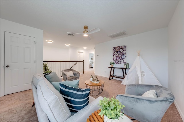 living room featuring carpet flooring and ceiling fan