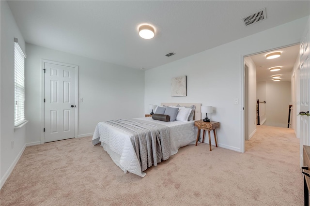 bedroom with light colored carpet