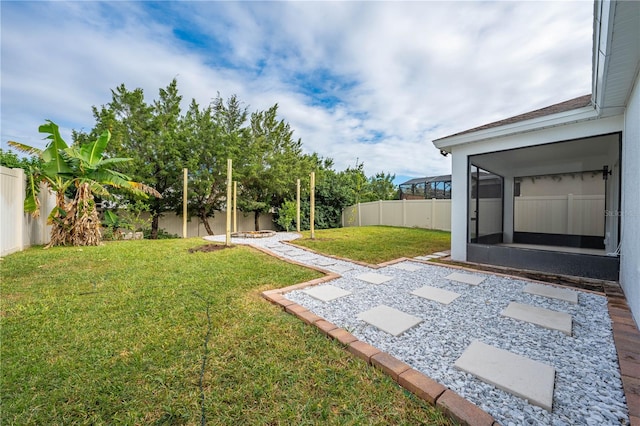 view of yard featuring a sunroom