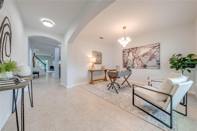 hall featuring light tile patterned floors and a notable chandelier