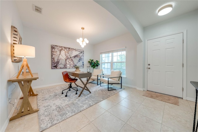 entrance foyer with a chandelier and light tile patterned floors