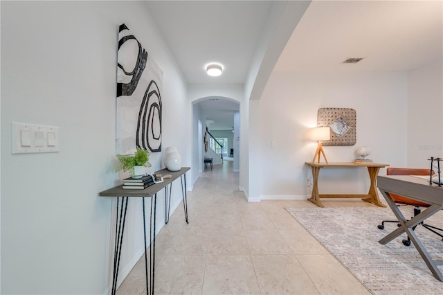 hall with light tile patterned flooring