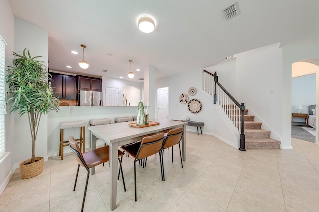 dining area with light tile patterned floors