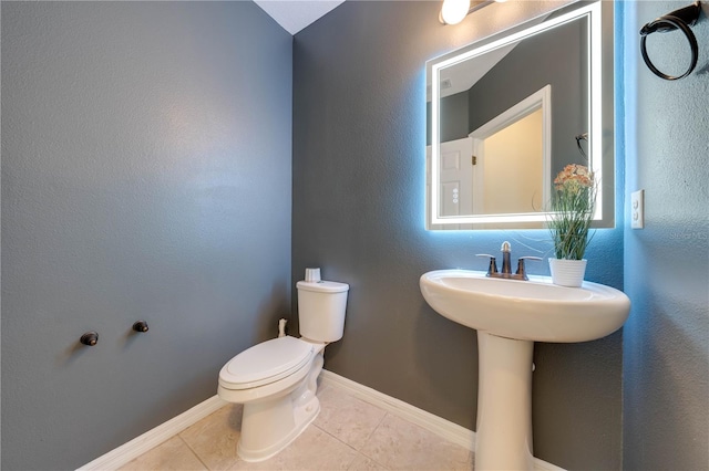 bathroom featuring tile patterned floors and toilet