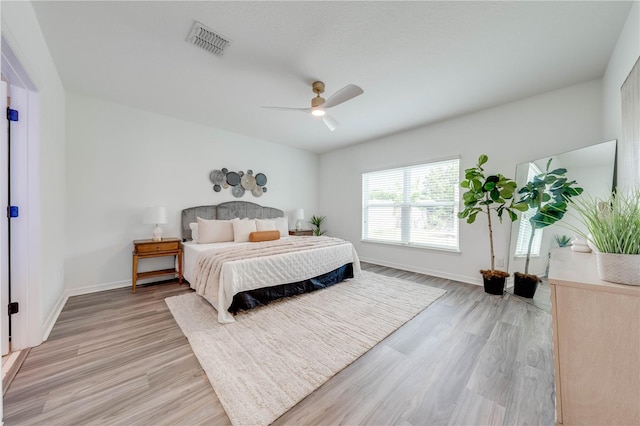 bedroom featuring light hardwood / wood-style flooring and ceiling fan