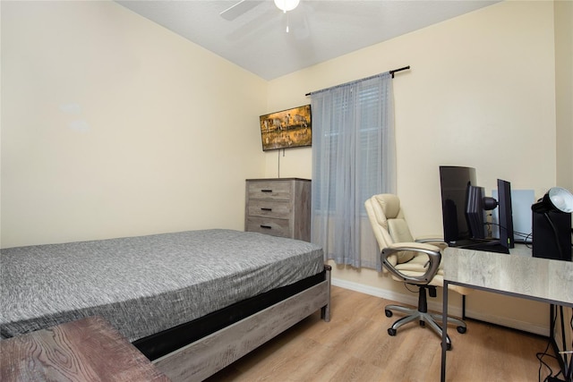 bedroom with ceiling fan and light hardwood / wood-style floors