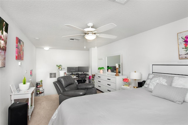 bedroom featuring a textured ceiling and ceiling fan