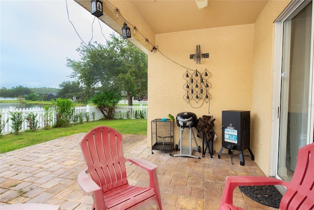 view of patio featuring a water view