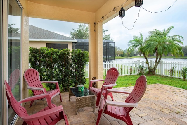 view of patio featuring a water view