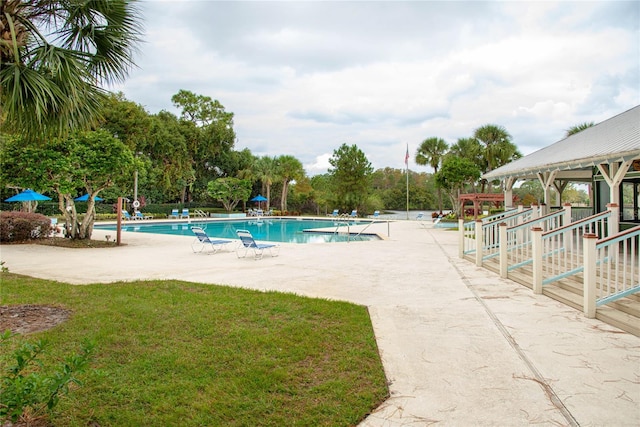 view of swimming pool featuring a gazebo and a lawn