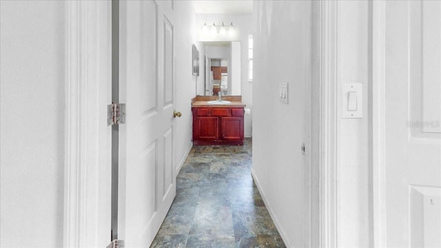 hallway featuring sink