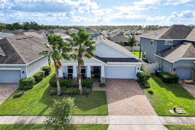 view of front of home with a garage and a front yard