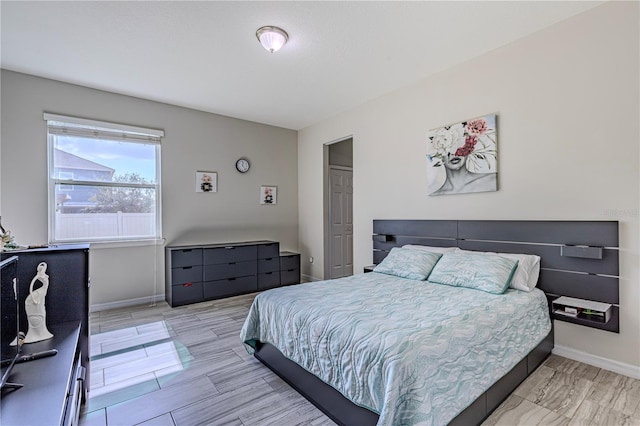 bedroom with a closet and light wood-type flooring