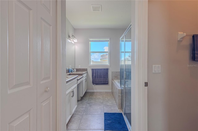 bathroom with tile patterned flooring, vanity, and separate shower and tub