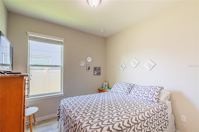 bedroom with light wood-type flooring