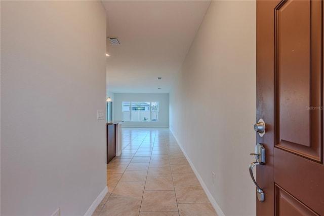 corridor featuring light tile patterned flooring