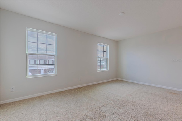 unfurnished room featuring carpet flooring