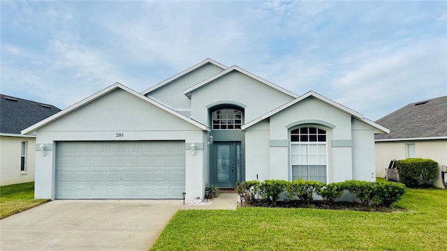 single story home with a garage and a front lawn