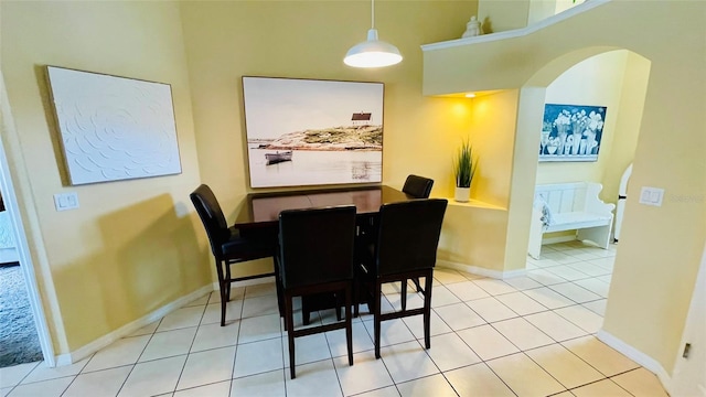 dining space with light tile patterned flooring